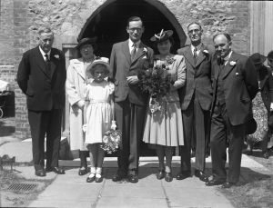 Wedding of C.R. Wiseman 21st November 1940 at St. Andrews Church. His father, Ambrose Wiseman is on the left. He became Chairman of the board of directors for the Enfield Gazette after Sir H Bowles passed away.