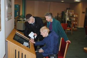 Visitors trying out the interactive kiosk